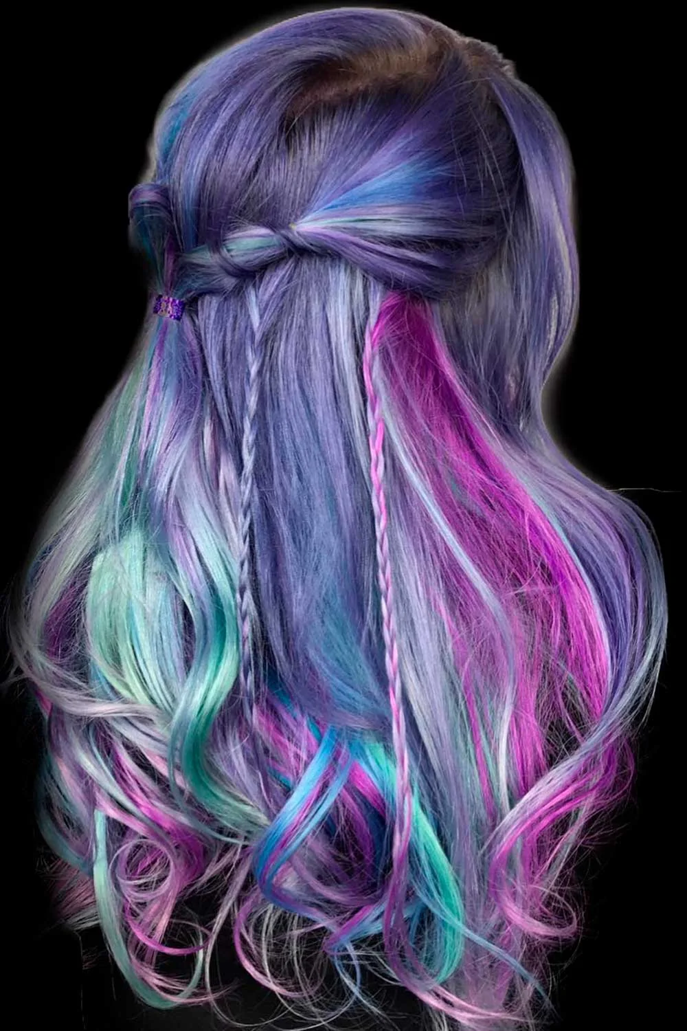Back view of purple hair with a small twisted half-up join and blue, mint and pink waves