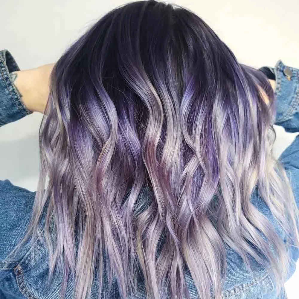 Back view of shoulder-length waves with a dark crown and pale silver-lavender lengths