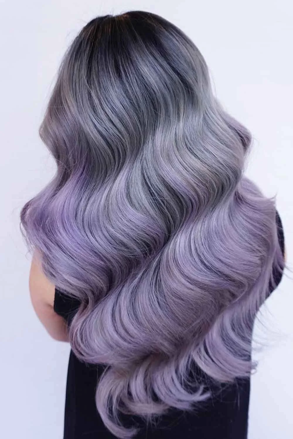 Back view of long smooth waves in gray-lavender with a darker shadow root