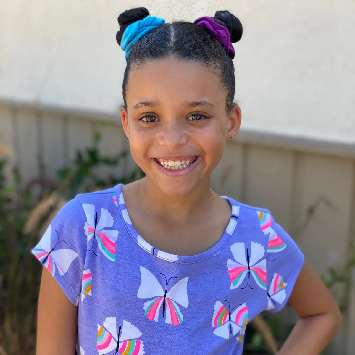 shoulder straight brunette bun shown as a school hairstyles idea
