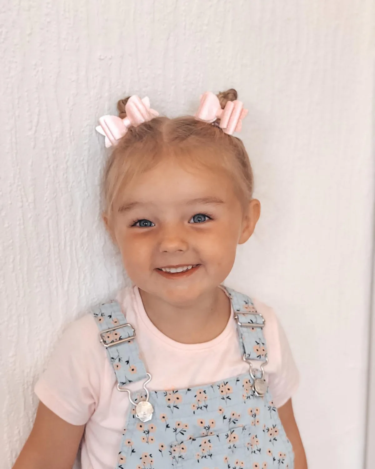 shoulder straight chestnut space buns shown as a school hairstyles idea, featuring chestnut color