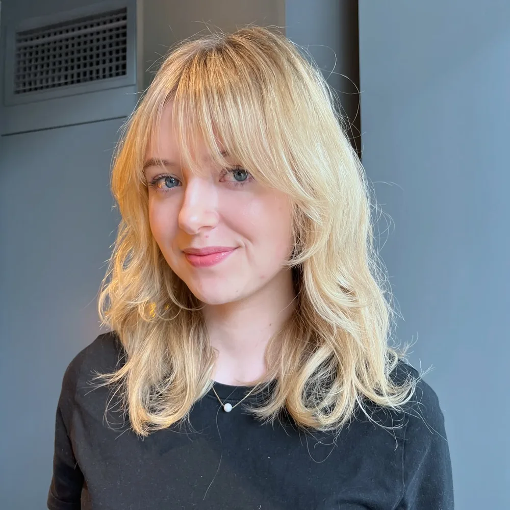 shoulder wavy blonde shag with wispy fringe shown as a shag hairstyles for medium length thin fine hair idea