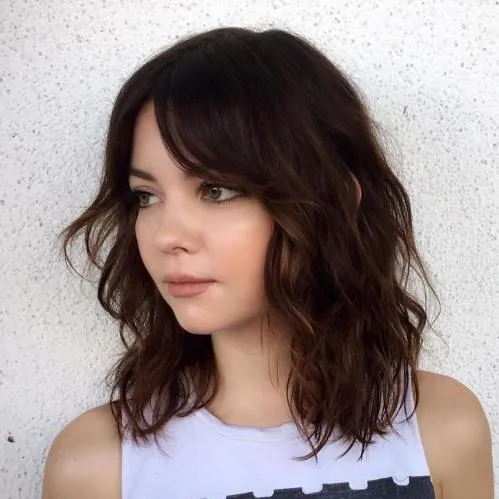 shoulder wavy chestnut shag with curtain fringe shown as a shag hairstyles for medium length thin fine hair idea, featuring wavy texture