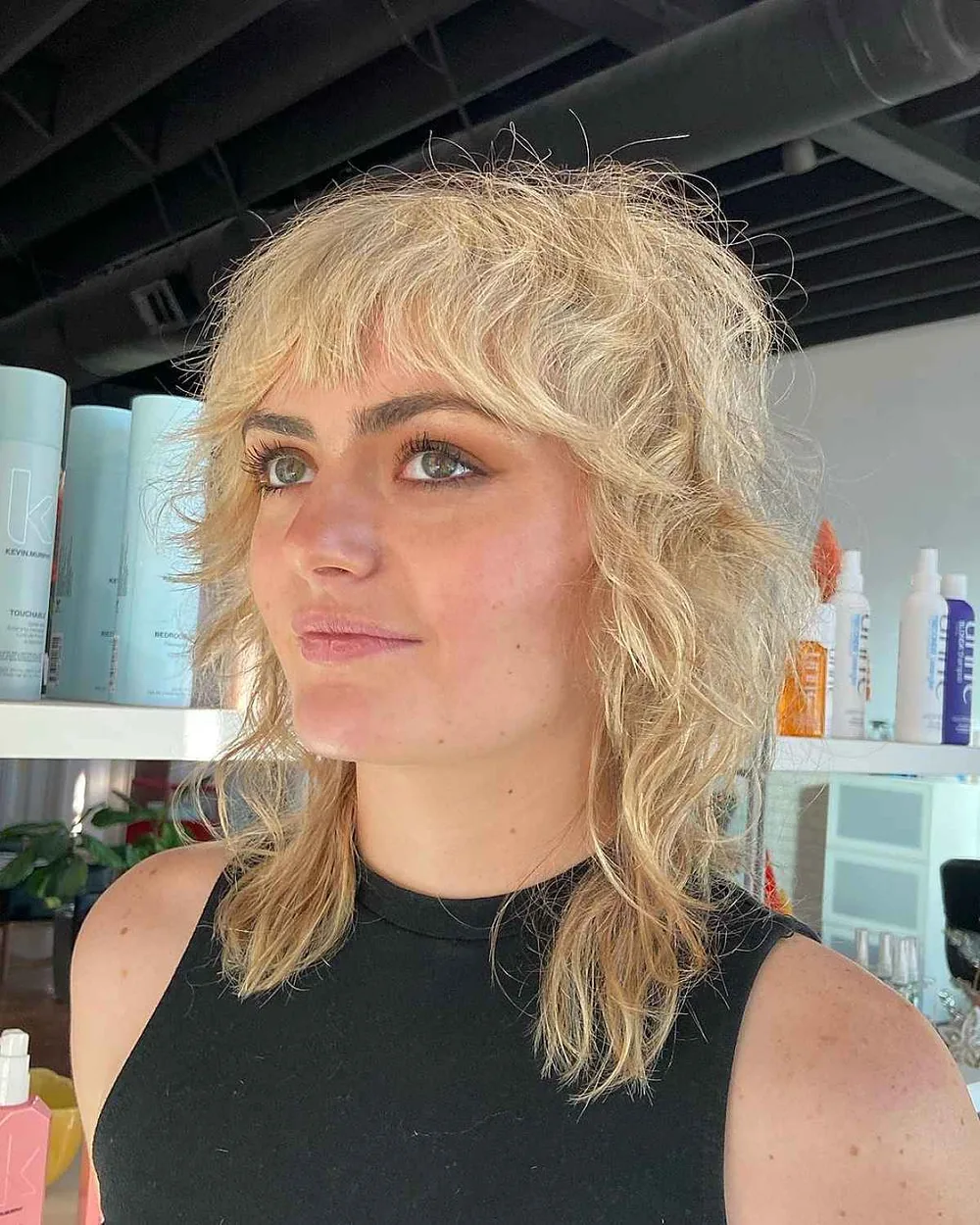 shoulder wavy chestnut shag with curtain fringe shown as a shag hairstyles for medium length thin fine hair idea, featuring textured finish