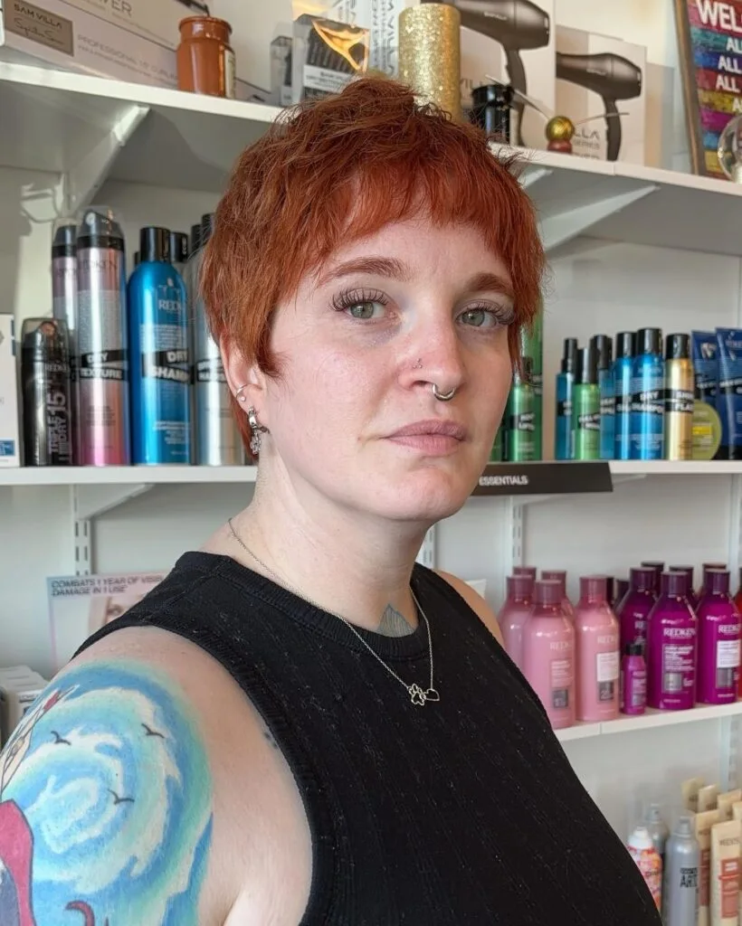 ear straight red pixie with micro fringe shown as a shag pixie hairstyles thin fine hair idea