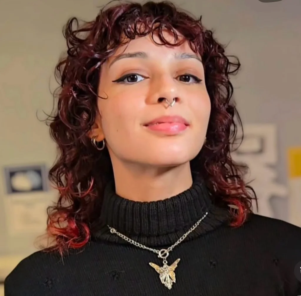 shoulder curly brunette shag with curly fringe fringe shown as a shaggy lob idea