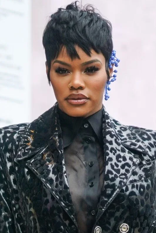 ear curly black pixie with curly fringe fringe shown as a shaggy pix mullet idea