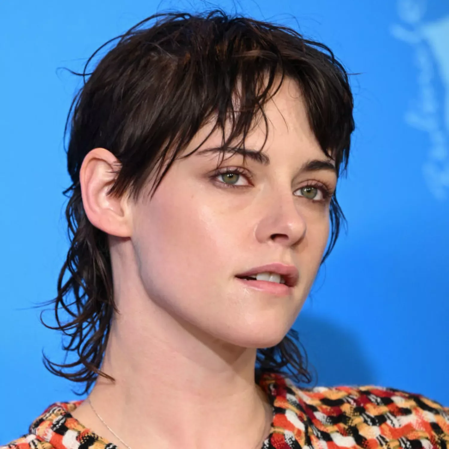 ear straight chestnut pixie with side swept fringe shown as a shaggy pix mullet idea
