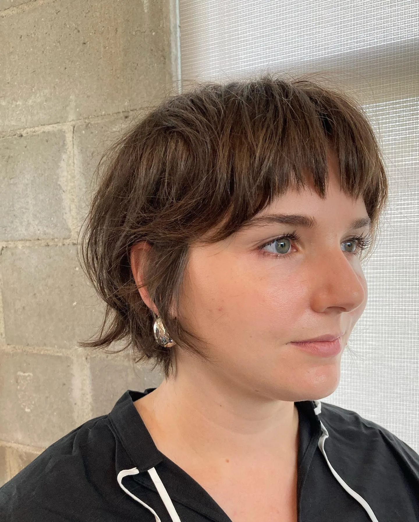 ear wavy brunette shag with micro fringe shown as a shaggy pix mullet idea