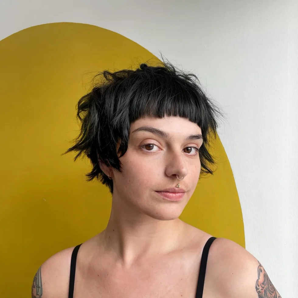 ear straight chestnut pixie with micro fringe shown as a shaggy pix mullet idea
