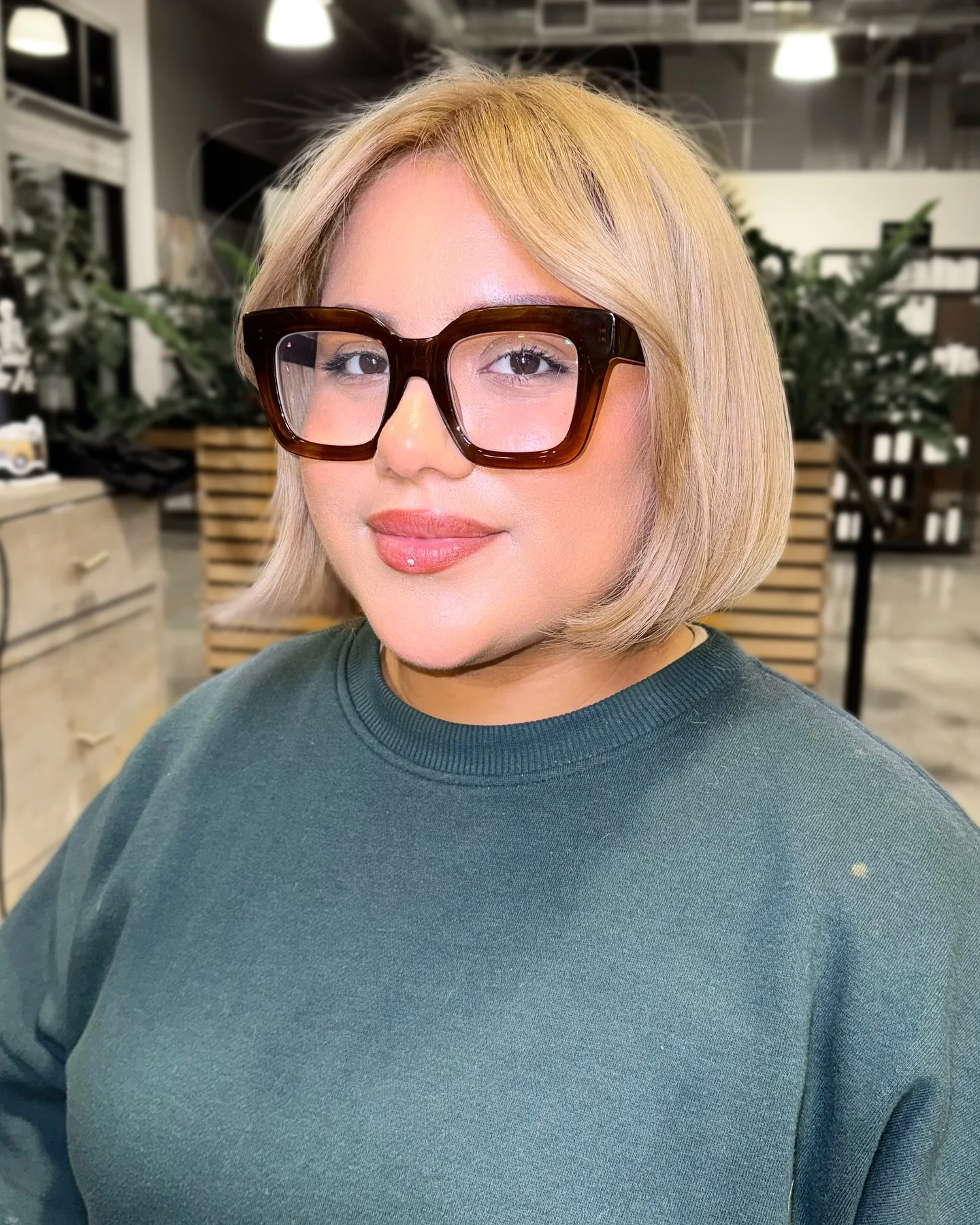 Short blonde bob with glasses and soft face-framing sides