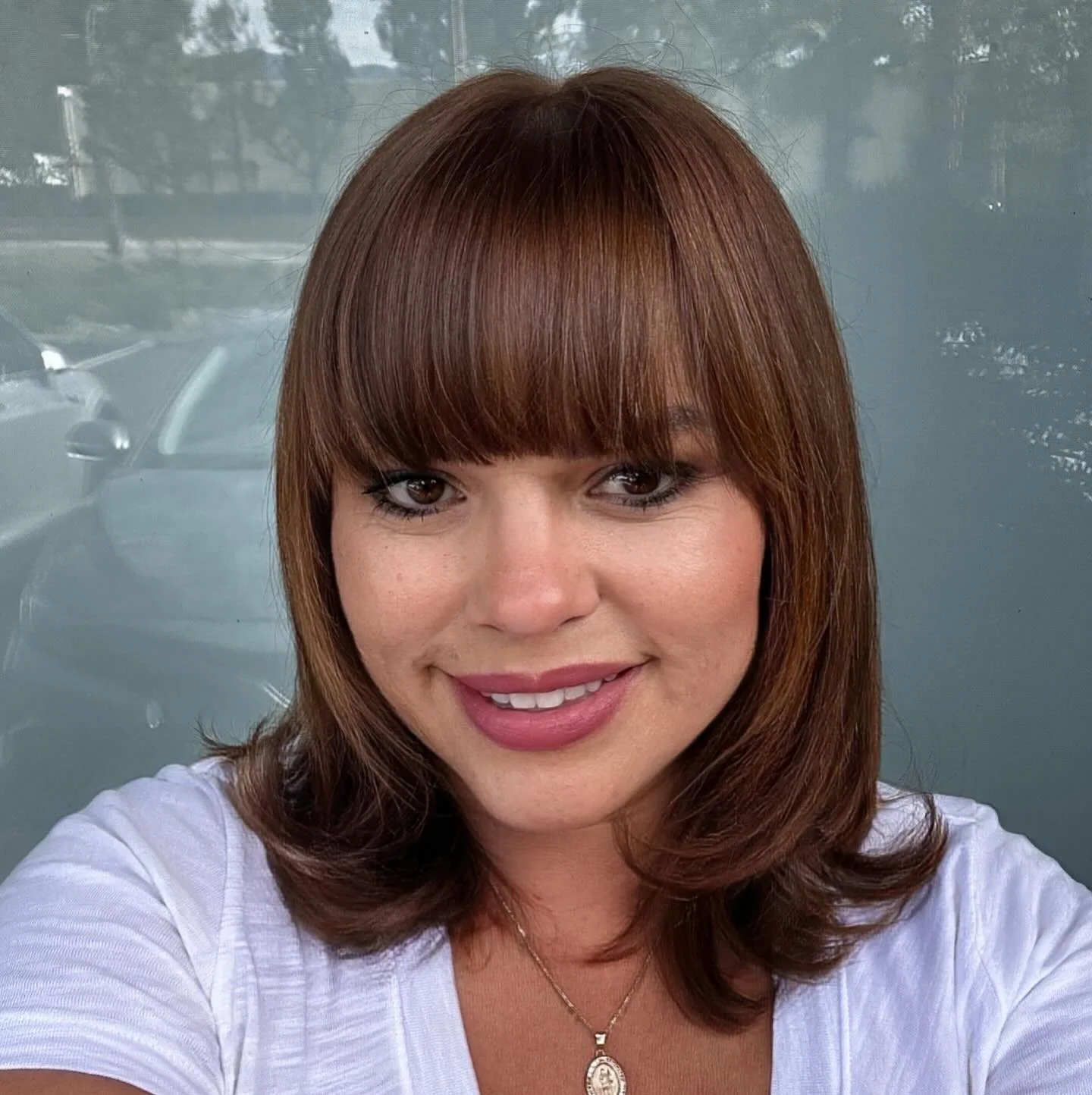 Red short bob with side volume and soft full bangs