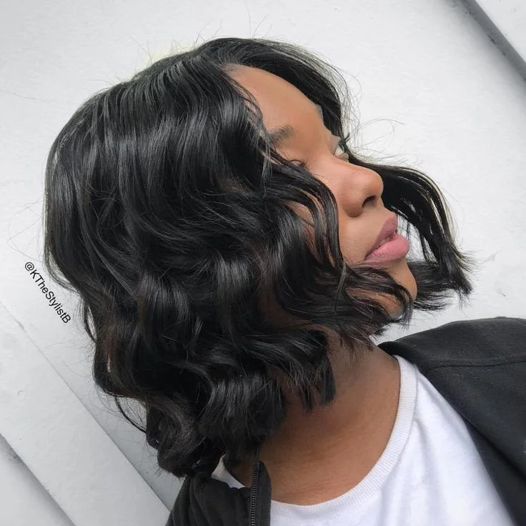 Dark short bob with bangs and rounded fringe movement