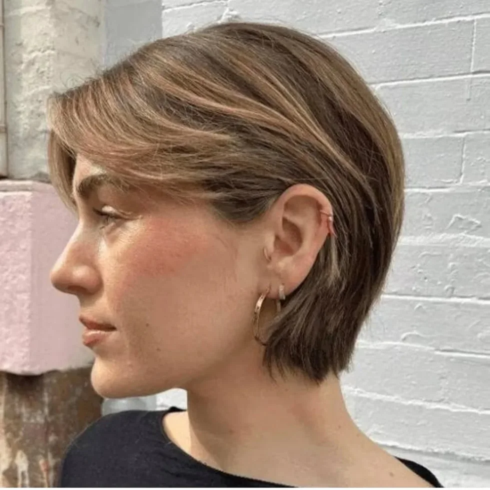 Soft side-part bixie haircut with short layered ends for fine hair