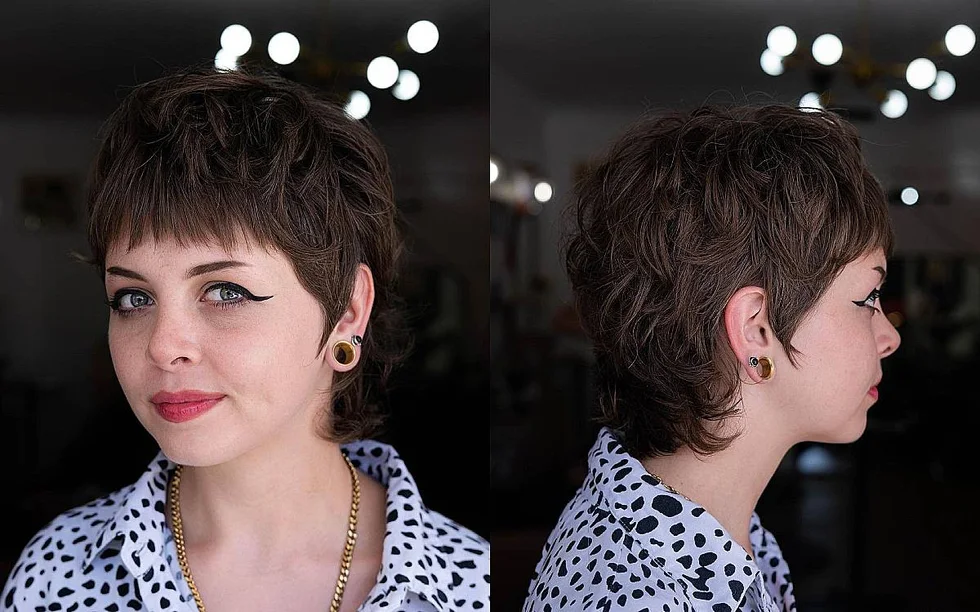 Short brunette bixie with bangs and layered side shape