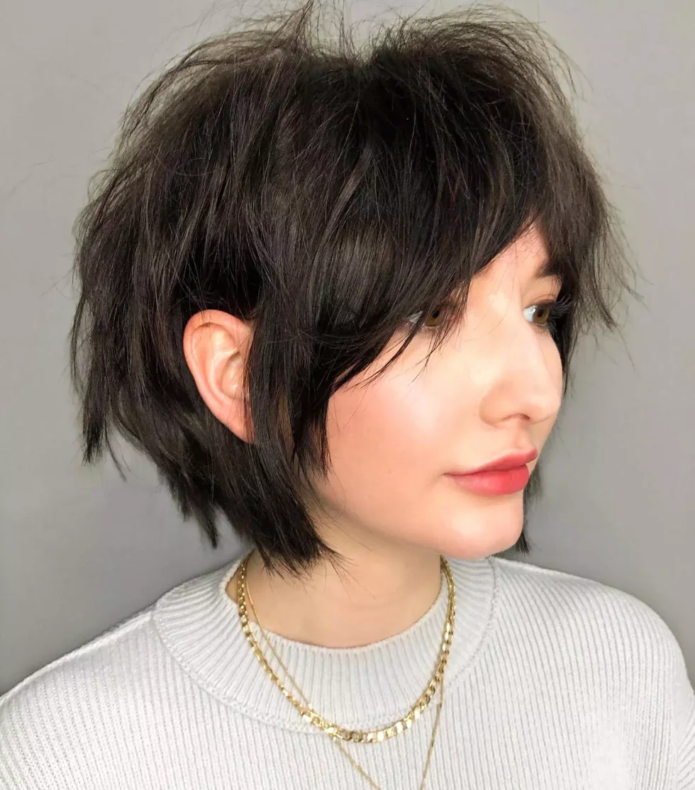 Shaggy black pixie bob with airy layers for fine hair