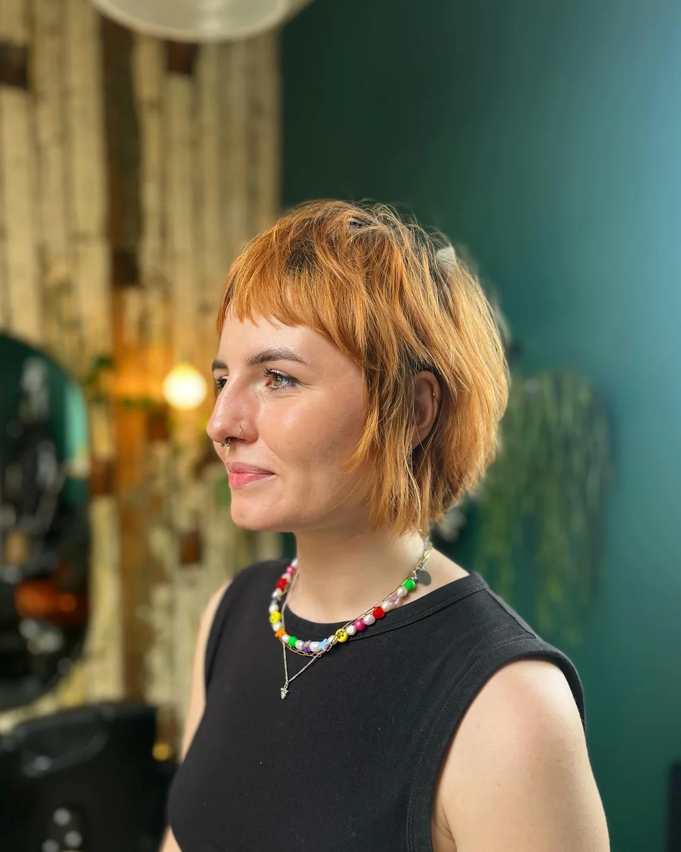Copper short shag bob with feathered texture for fine hair