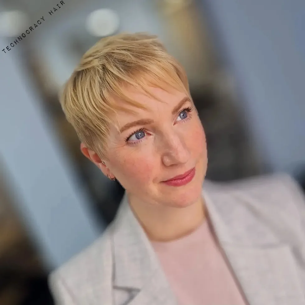 Soft blonde cropped pixie with neat sides for fine hair