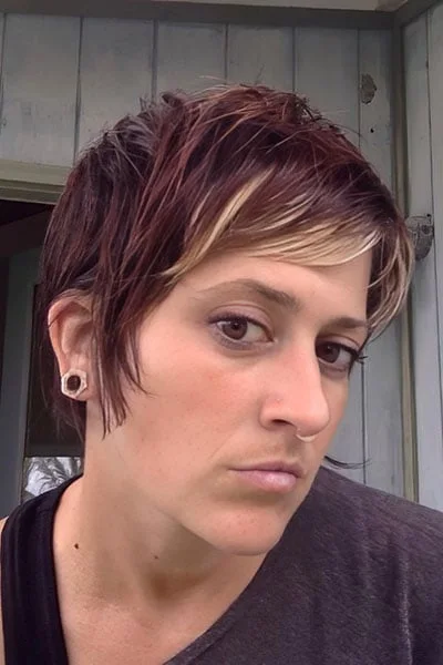 Plum piecey pixie haircut with short layers and side texture