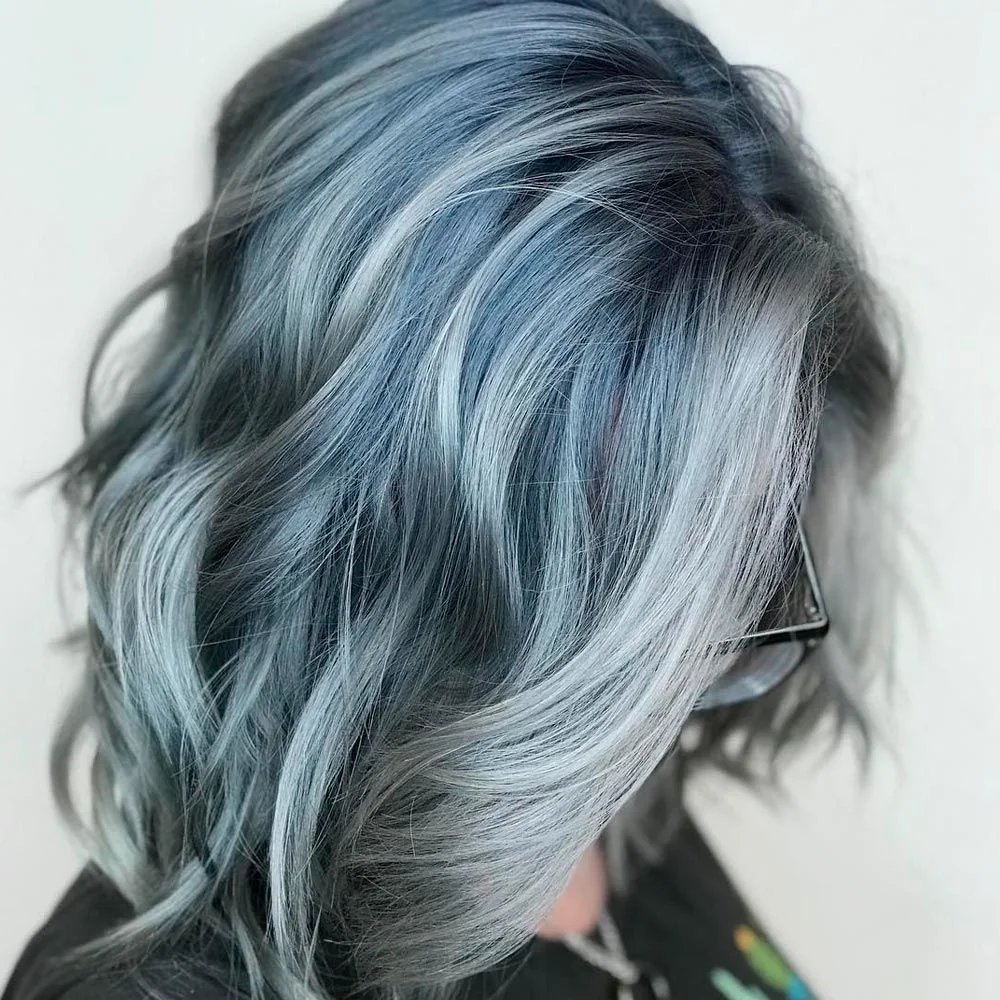 Side view of a blue-gray bob with broad waves and a lighter front ribbon