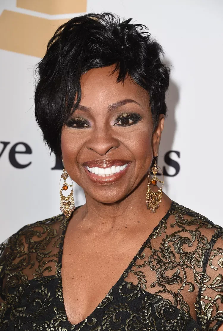 Older Black woman with a short black pixie and side-swept volume