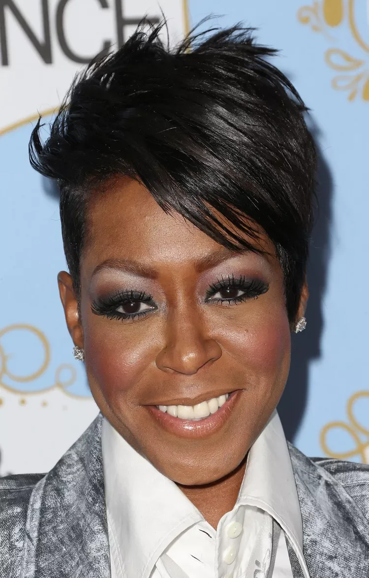 Older Black woman with a lifted short pixie and clean tapered sides