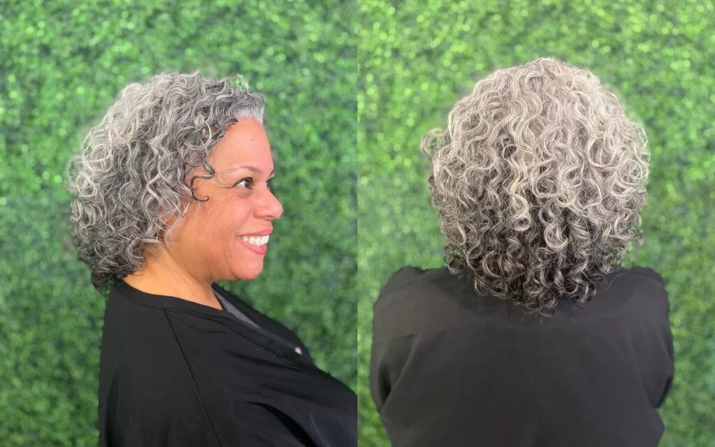 Older Black woman with a gray side-view curly bob and rounded volume