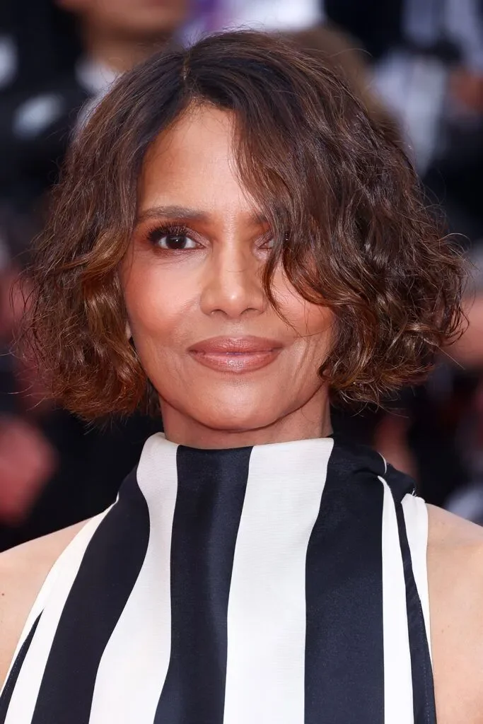 Older Black woman with a highlighted chin-length bob and loose face-framing waves