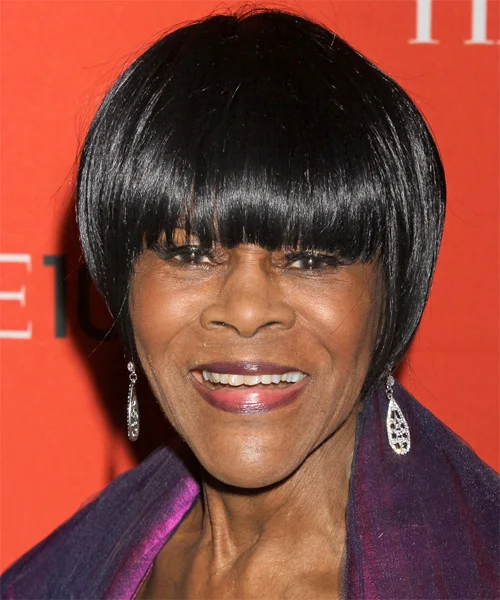 Older Black woman with a black rounded chin bob and full bangs