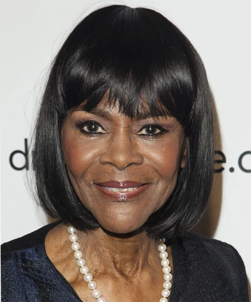 Older Black woman with a polished black chin bob and soft rounded shape