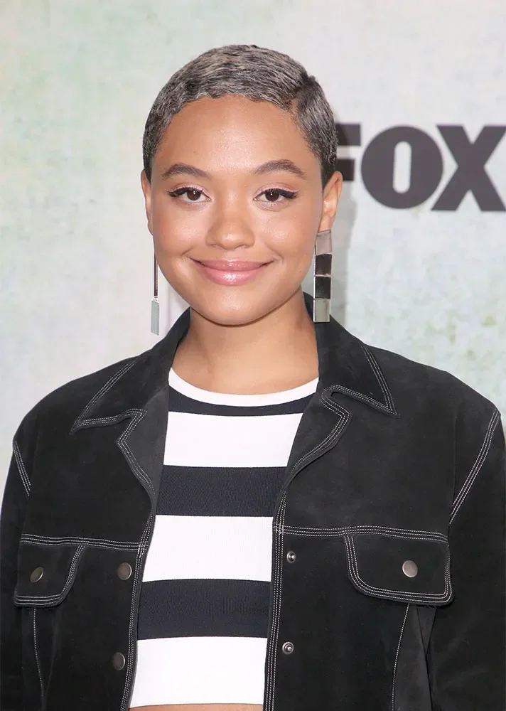 close black pixie with soft top texture and short clean sides on a round face with thin hair