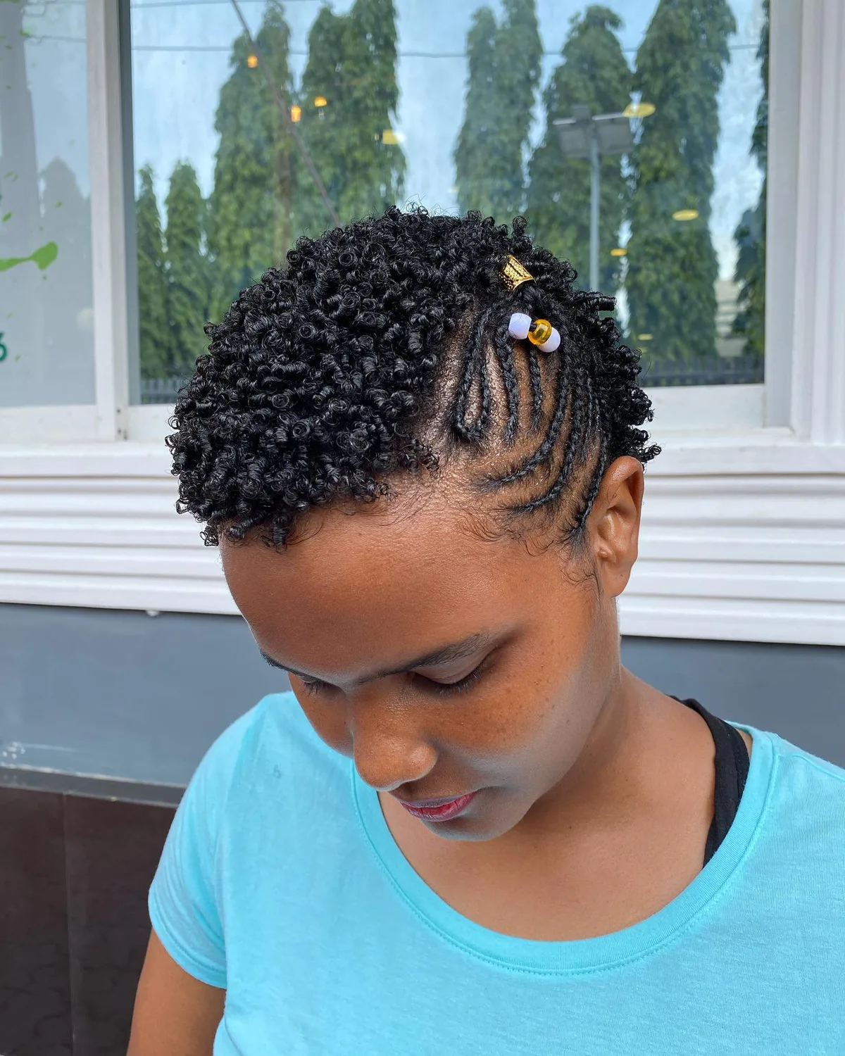 ear coily black cassie braids shown as a short natural hairstyles for black women over 50 idea