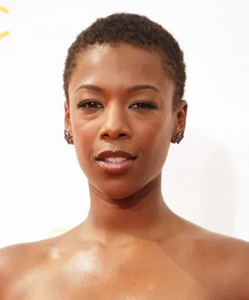 ear coily black curly style shown as a short natural hairstyles for black women over 50 idea, featuring medium layering