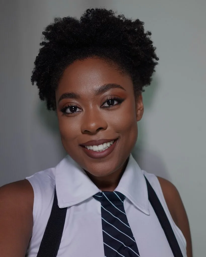 ear coily black curly style shown as a short natural hairstyles for black women over 50 idea, featuring natural finish, shown in black coily curly style with natural finish with natural finish