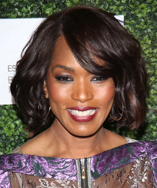 Soft wavy black pixie cut with side-swept movement
