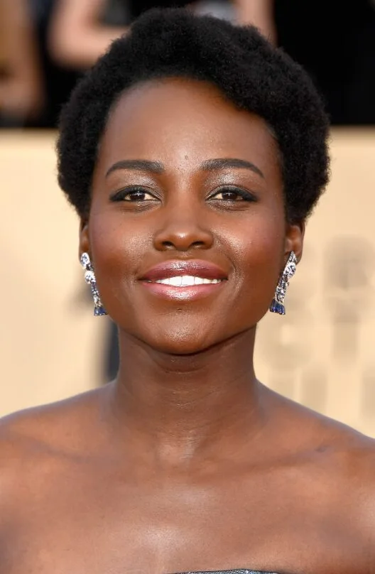 Soft natural black pixie crop with short coily texture