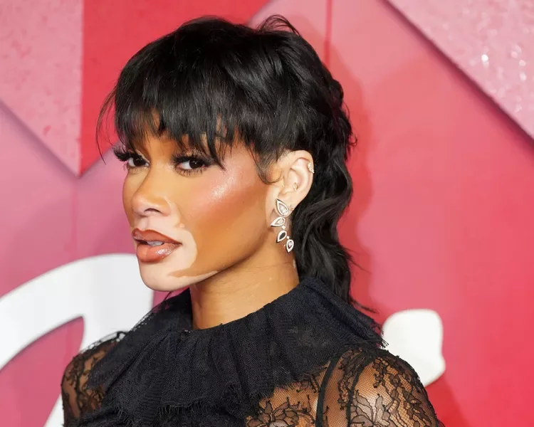 Black pixie cut with full fringe and polished short sides