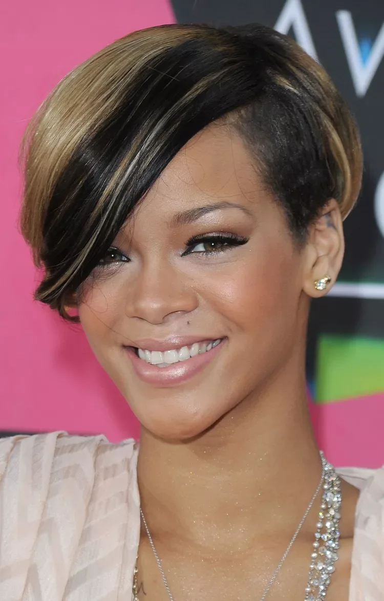 Glossy side-swept black pixie cut with a smooth angled fringe