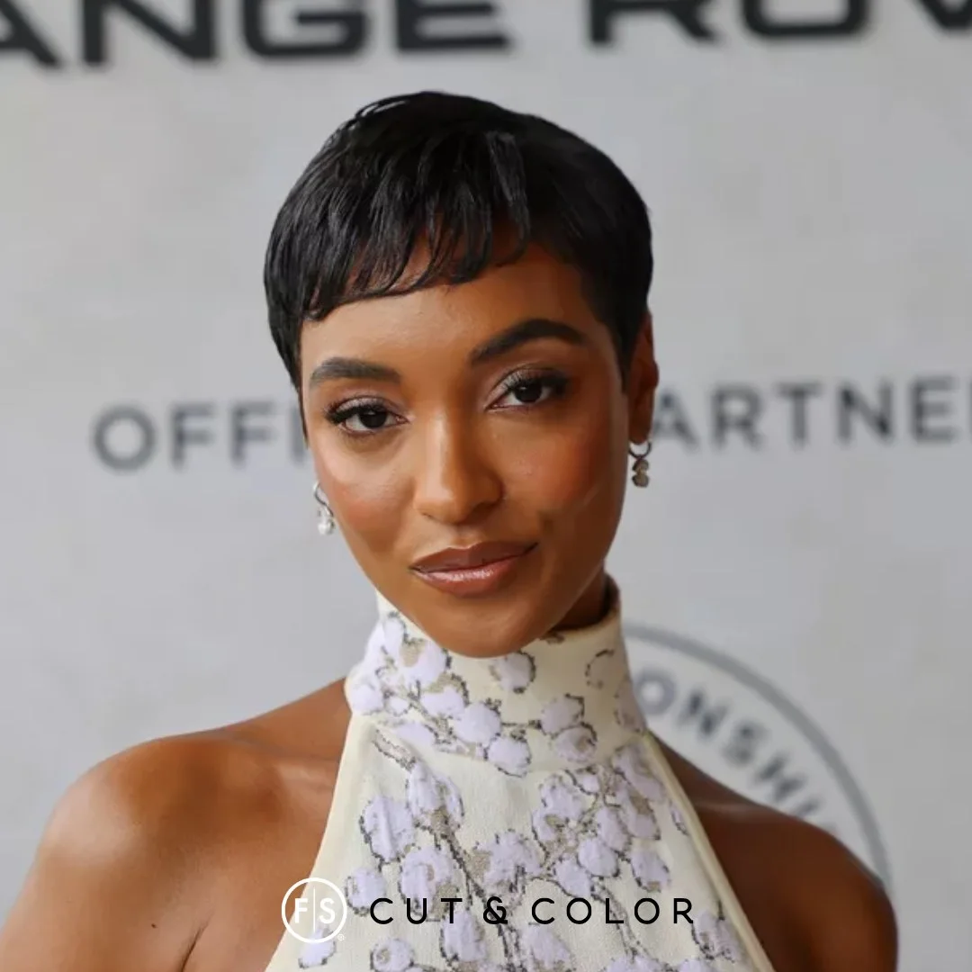 Tiny fringe black pixie cut with cropped sides and a sleek finish