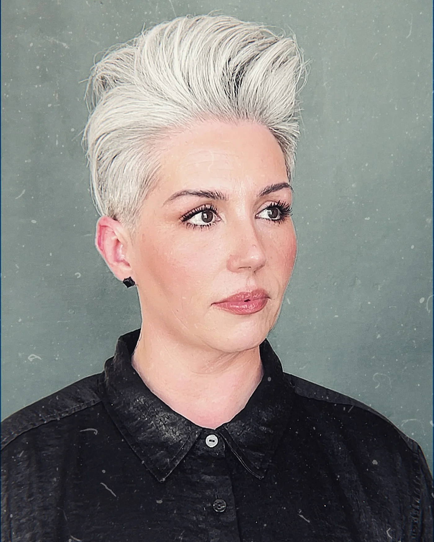 White textured short pixie haircut for an older woman with cropped sides