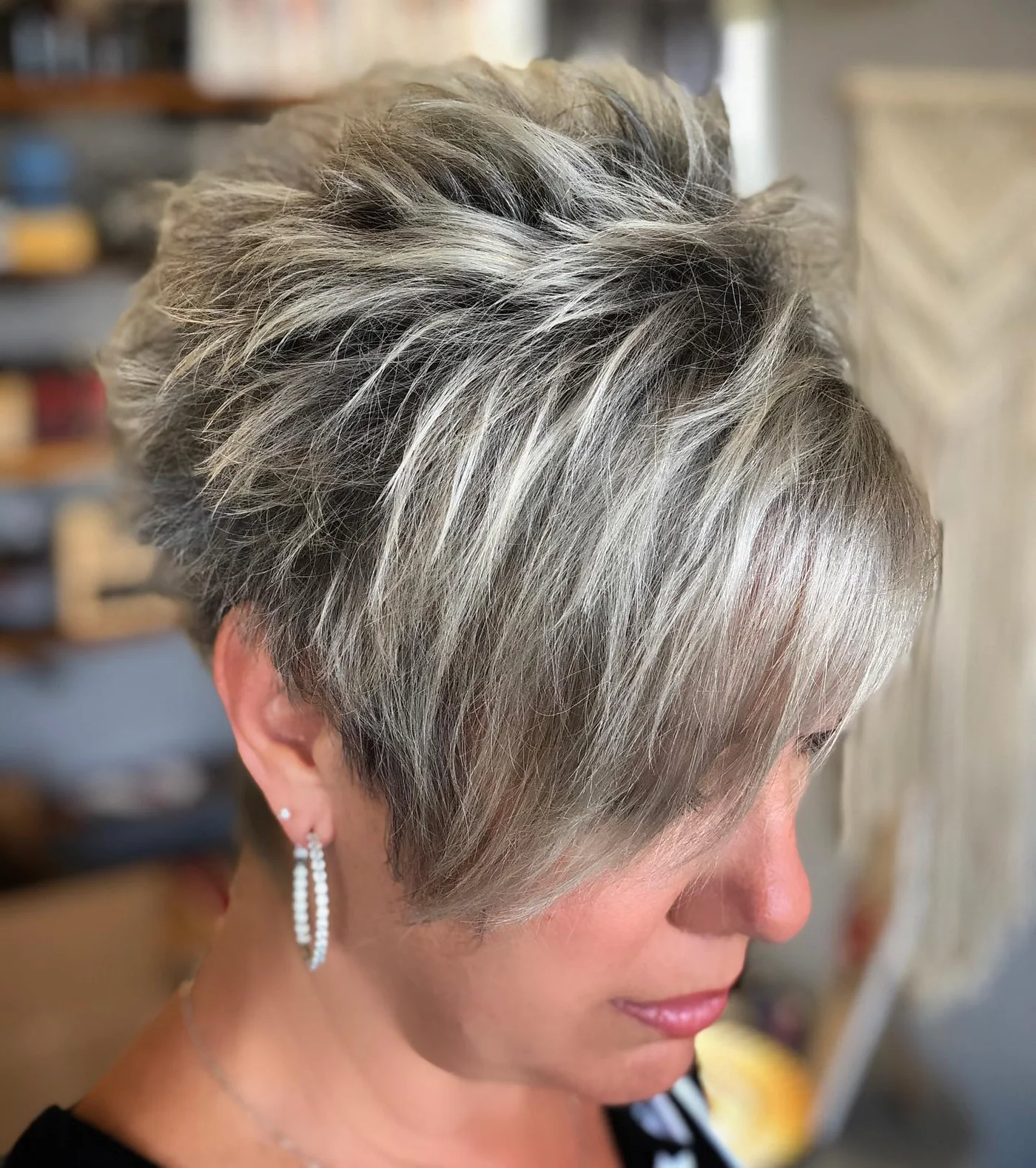 Spiky silver short pixie haircut for an older woman with textured crown