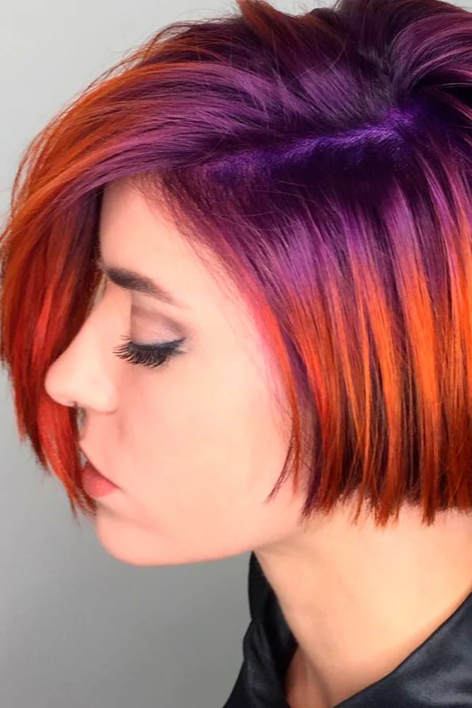 Side view of a short straight bob with a violet crown, copper-orange lengths and blunt ends