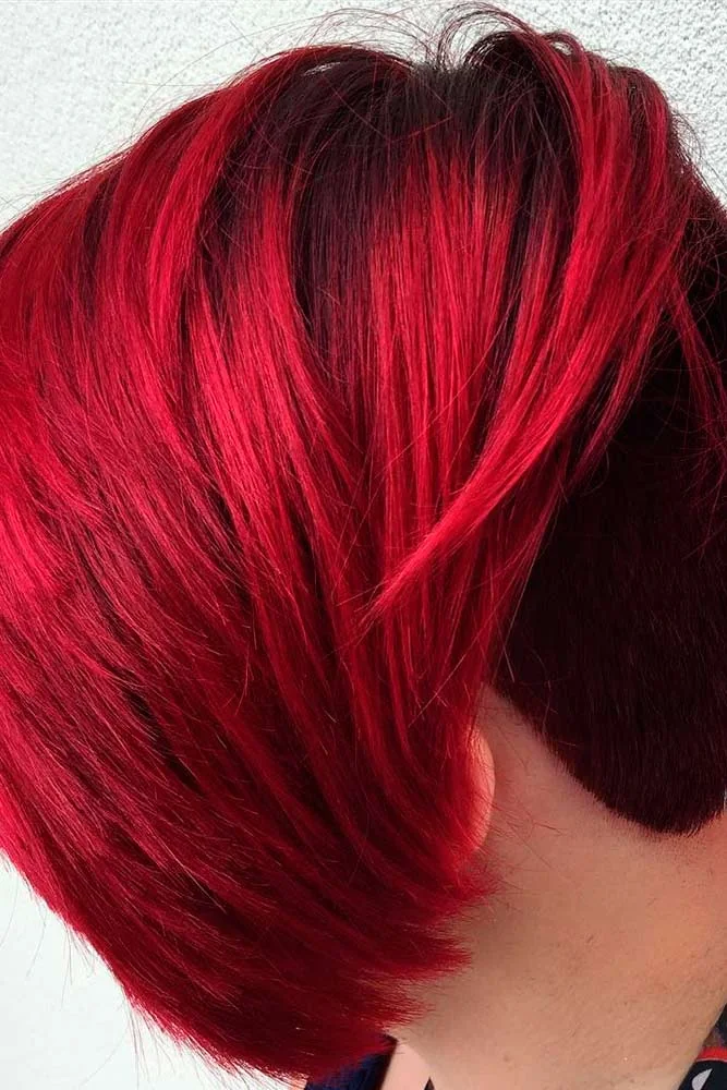 Back-side view of a short scarlet bob with a rounded nape and longer front edge