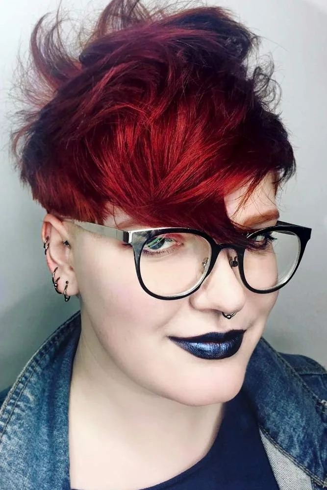 Front-side view of a textured short pixie with burgundy crown, dark sides and long swept fringe
