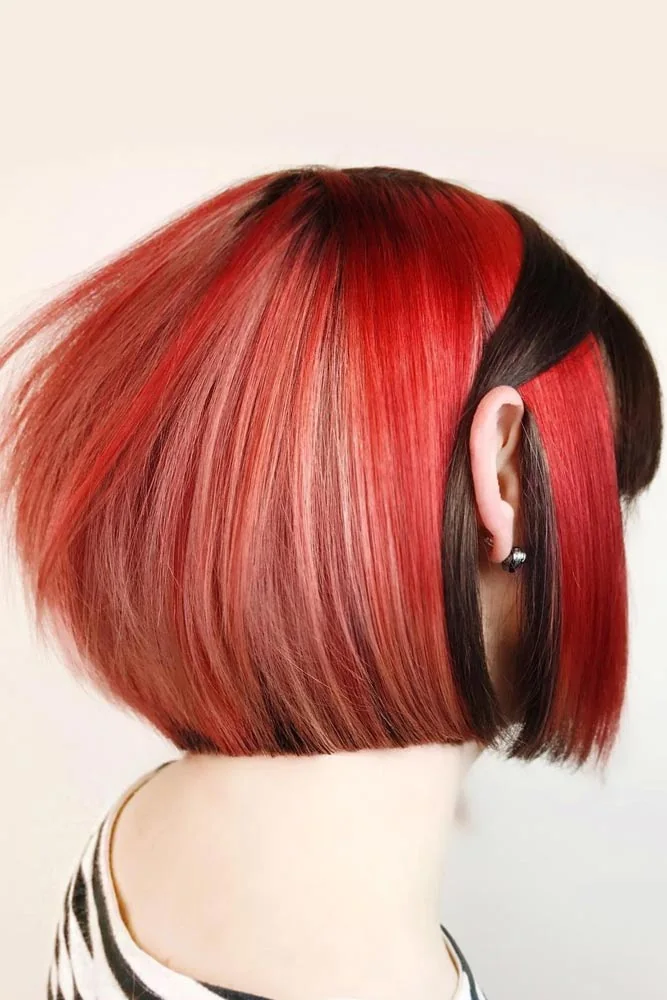 Back-side view of a smooth rounded red bob with narrow black panels near the ear and nape
