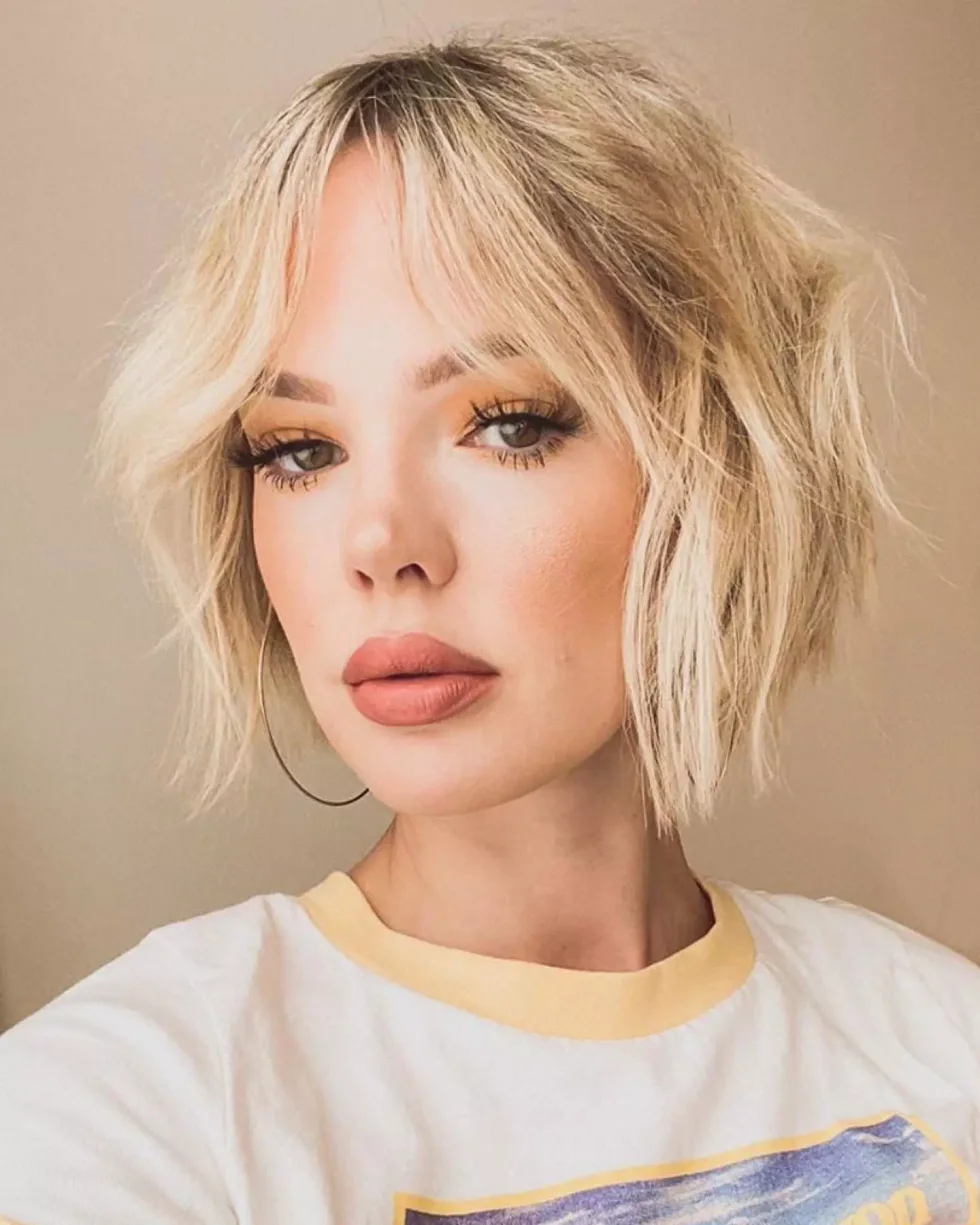 shoulder wavy chestnut shag with curtain fringe shown as a short shaggy hair idea, featuring wavy texture
