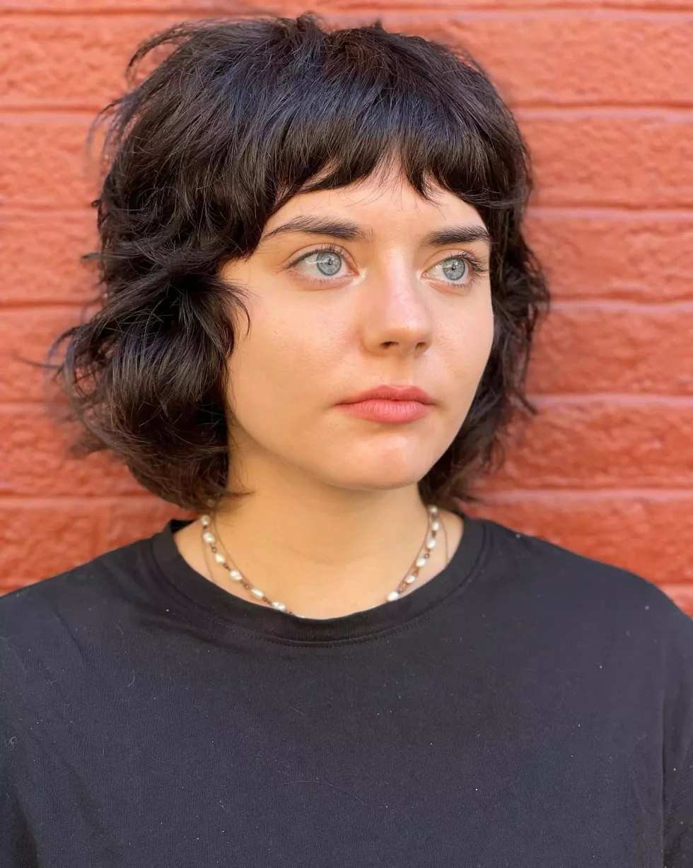 shoulder wavy chestnut shag with curtain fringe shown as a short shaggy hair idea, featuring shoulder outline