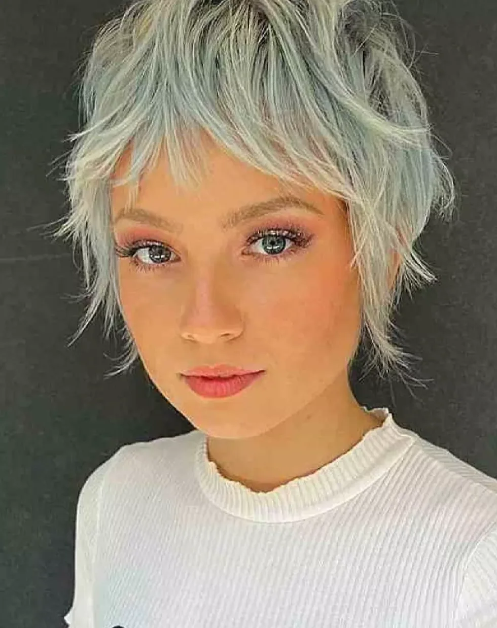 shoulder wavy chestnut shag with curtain fringe shown as a short shaggy hair idea, featuring curtain fringe, shown in soft auburn short shag