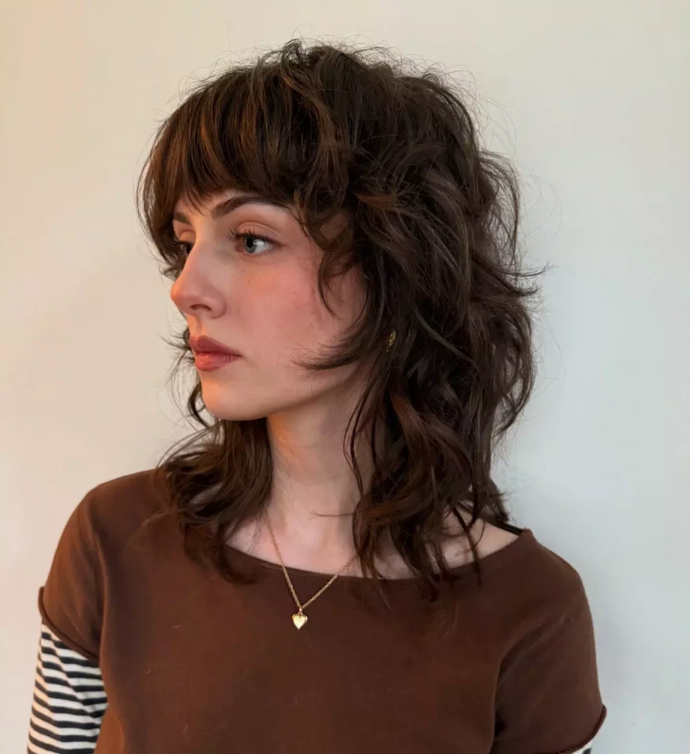 shoulder wavy chestnut shag with curtain fringe shown as a short wolf curtain bangs idea