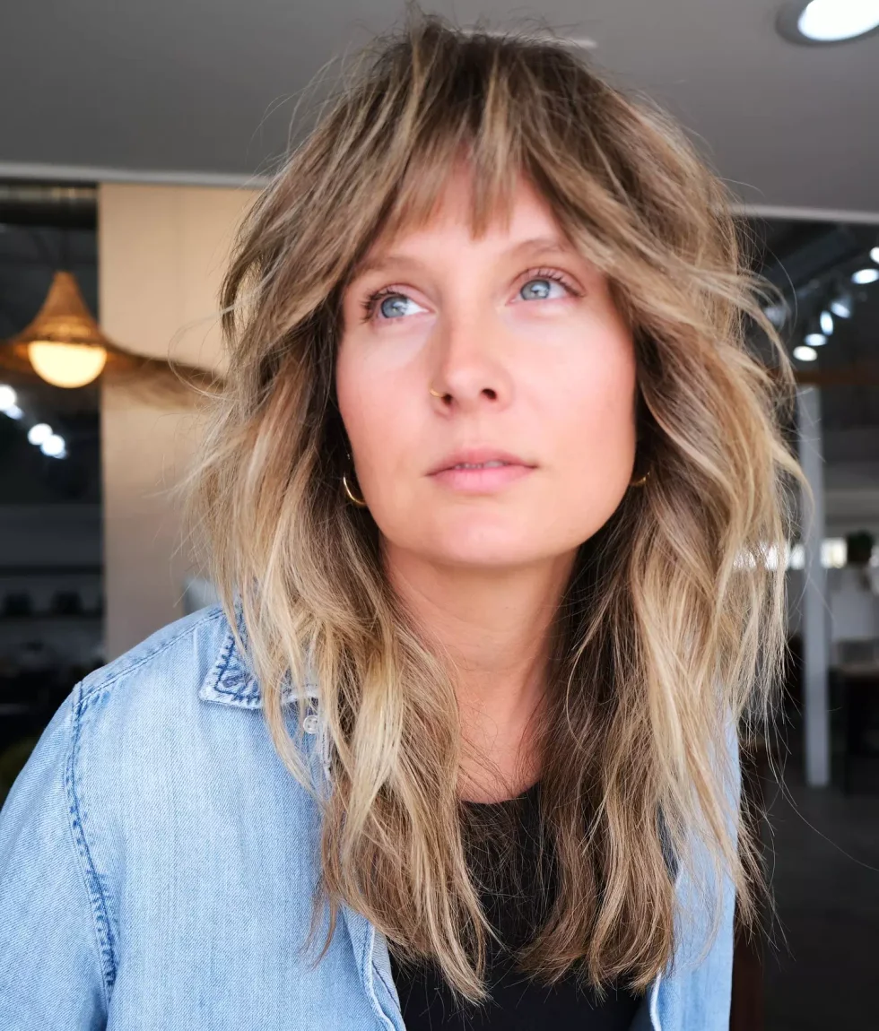 medium straight red bangs with blunt fringe shown as a short wolf curtain bangs idea